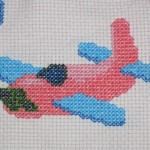 grille broderie avion